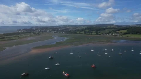 River Exe, South Devon, England: DRONE VIEWS: Moored boats on River Exe estuary Stock Footage 247826305