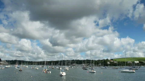 River fal clouds and boats timelapse Stock Footage