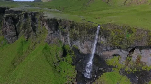 The river falls from the cliff and flows down the stones of Iceland. Andreev. Stock Footage 78549883