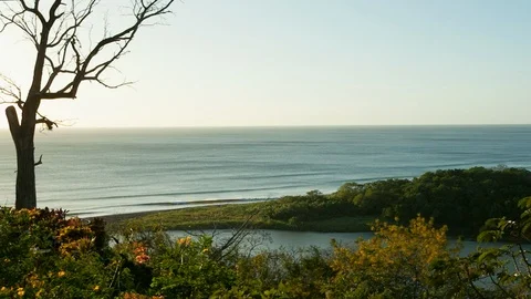 River falls in to the ocean landscape. View from high point. Stock Footage 107663213