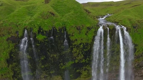 The river falls from the slope of the mountain by a waterfall. Andreev. Stock Footage 78073764