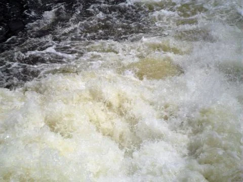 River fast stream close-up, dark water, white foam, Poltava, Ukraine Stock Photos