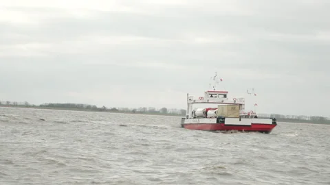 A river ferry crosses the river 스톡 동영상 219803932