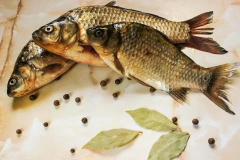 River fish with spices in its raw form Stock Photos