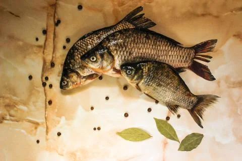 River fish with spices in its raw form Stock Photos