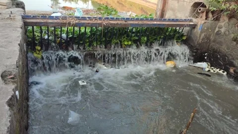 River fitted with iron nets to filter out trash. Stock Footage 247156338