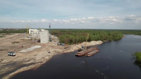 River floating crane unloads barges with bulk materials on the river bank. Stock Footage 240333971