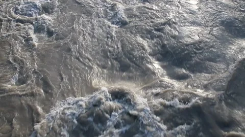 River in flood with rushing water Stock Footage 267886347