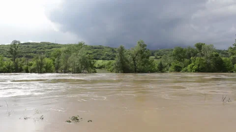 River flooded agricultural fields after big storm. Ecological disaster. Dark sky Stock Footage 39007441