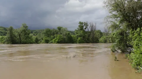 River flooded agricultural fields after big storm. Natural disaster. Cloudy sky. Stock Footage 39007923