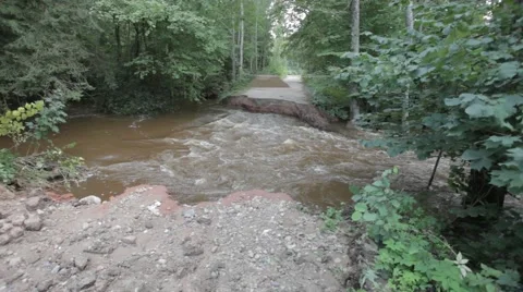River flooding after rainfall, broken road 動画素材 41893538