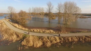 River floods overflow in the Netherlands at the dikes Stock Footage 85891376