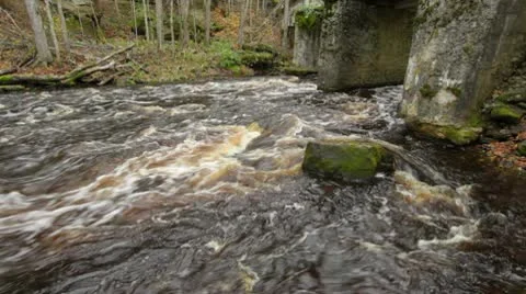River flow and an old bridge Stock Footage 10587480