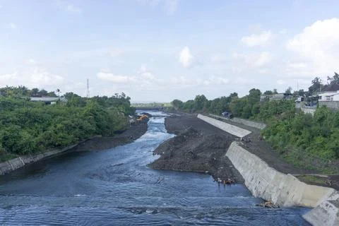 River flow at construction site. The river divides the construction site Stock Photos