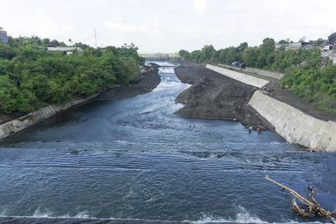 River flow at construction site. The river divides the construction site Stock Photos