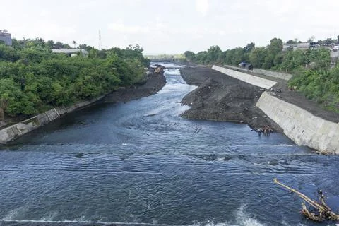 River flow at construction site. The river divides the construction site Stock Photos