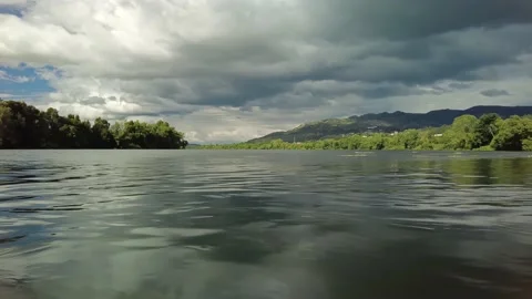 River flow in the forest with the clouds before rain. Water surface. Mountains Stock-Footage 153755877