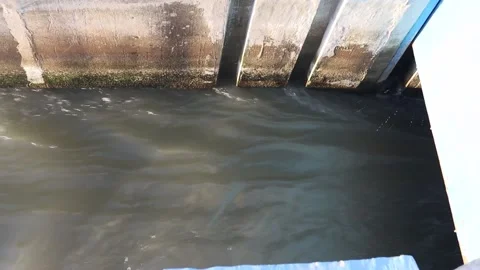 River flow that passes through the floodgate Stock Footage 219397305