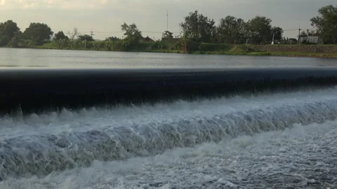 River Flow Rubber Dam 4K Stock Footage 308720160