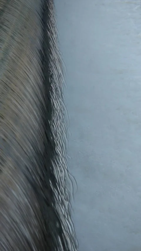 River Flow Rubber Dam Slow Motion (vertical) Video stock 308697639
