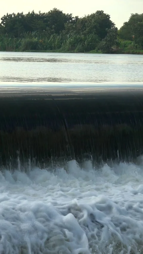 River Flow Rubber Dam Slow Motion (vertical) Video stock 308703708