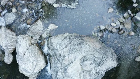 River flow Stream In Forest Rocks and Nature Drone Stock Footage 163165878