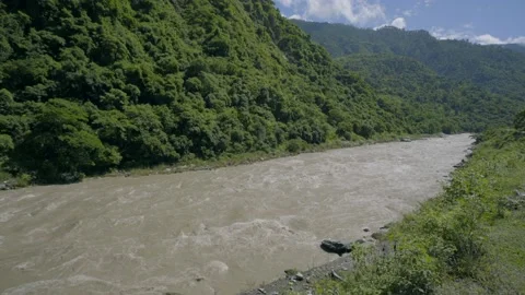 River flowing along the raod and mountain Stock Footage 201839829