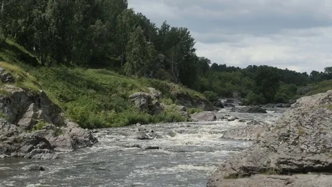 River flowing among rocks Видео 77337798