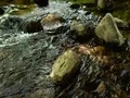 River flowing around and over rocks - time lapse 4k or 4k+ Resolution
