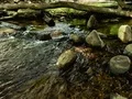River flowing around and over rocks - time lapse 4k or 4k+ Resolution