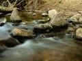 River flowing around and over rocks - time lapse 4k or 4k+ Resolution