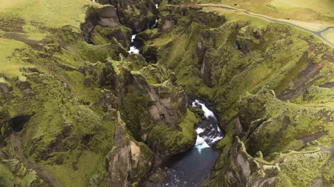 River flowing between mountains in an aerial Stock Footage 264627092