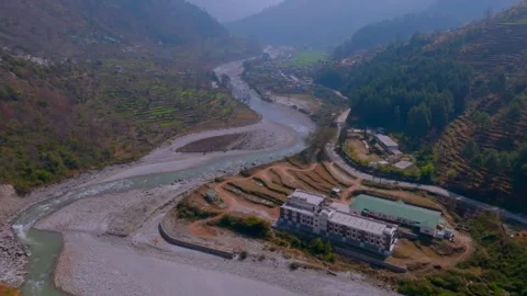 River flowing between the mountains of Uttarakhand Stock Footage 307676802