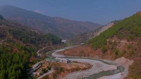 River flowing between the mountains of Uttarakhand during summer season Stock Footage 307676943