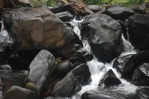 River flowing between the rocks in Goa Stock Photos