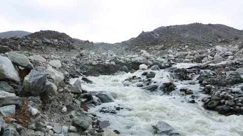 River flowing down the hill through rocks Stock Footage 77450207