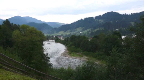 The river flowing in the green valley between the mountains Video stock 41257580
