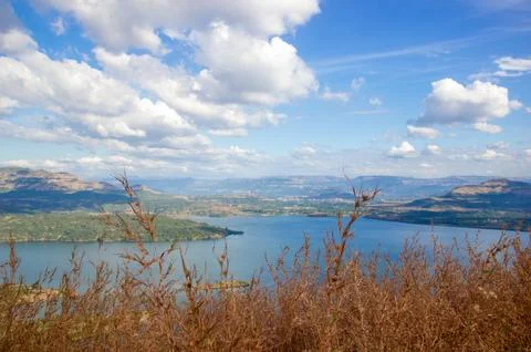 River flowing in middle of hills Stock Photos