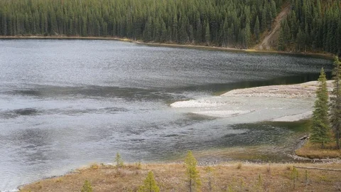 River Flowing in to the Mountain Lake Stockbeeldmateriaal 81410209
