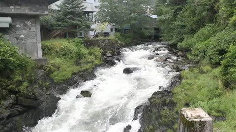 River flowing from mountain through town in Ketchikan, Alaska - 002 Stock Footage 21146615