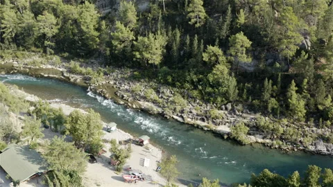 A river flowing in the mountains in a narrow deep valley with steep banks Stock Footage 118996932