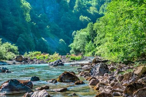 River flowing in mountains Stock Photos