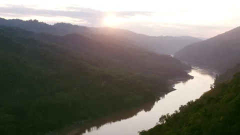 River flowing next to trees aerial Stock Footage 279023552