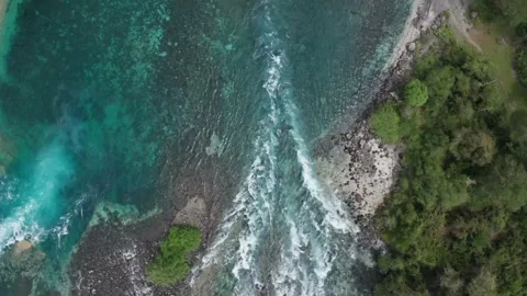 River Flowing into the Ocean from Above Stock Footage 303082971