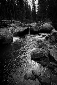 River flowing over large rocks. Stock Photos