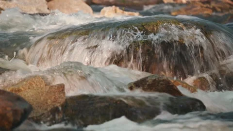 River flowing over rocks cascade on sunny day, closeup detail Stock Footage 296392750