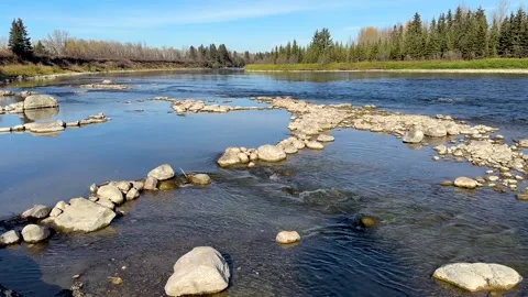 River flowing over rocks on a fall day Video stock 273074667