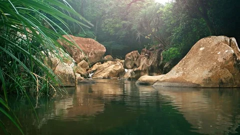 River Flowing over Rocks, Filling Natural Pool in Vietnam, with Sound Stockbeeldmateriaal 74988078