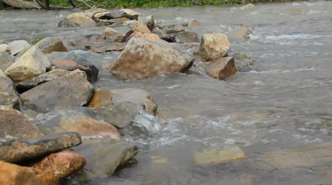 River flowing over stones Stock Footage 34411565