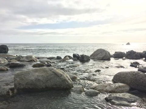 A River Flowing into the Pacific Ocean Stock Photos